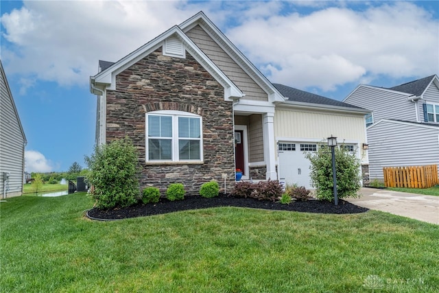 craftsman house with a garage, a front lawn, driveway, and stone siding