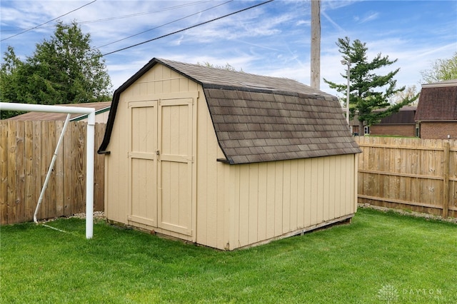 view of shed with a fenced backyard