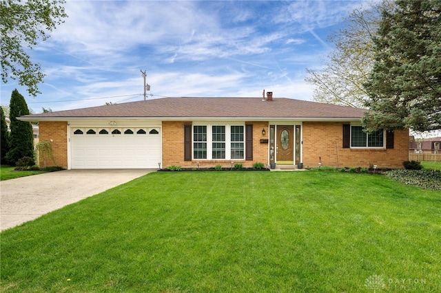 ranch-style home featuring brick siding, an attached garage, driveway, and a front yard