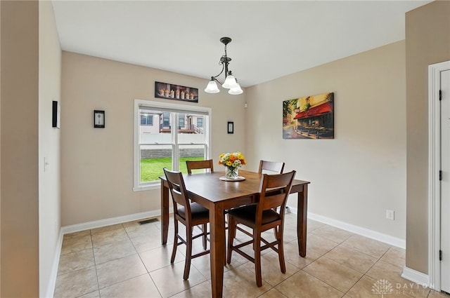 dining room with baseboards, visible vents, and light tile patterned floors