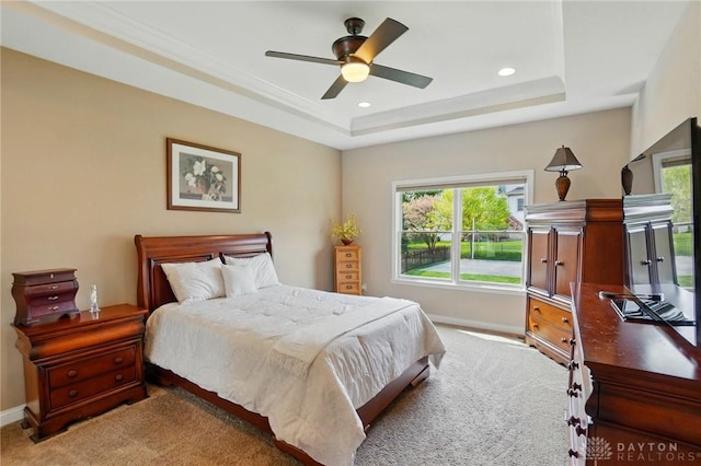bedroom with baseboards, carpet, recessed lighting, and a raised ceiling