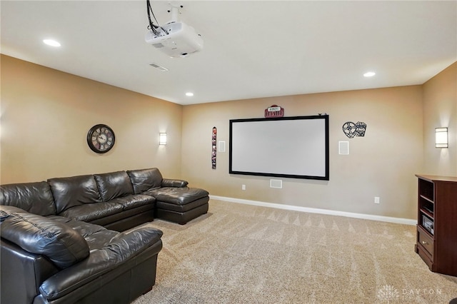 carpeted cinema room featuring baseboards, recessed lighting, and visible vents