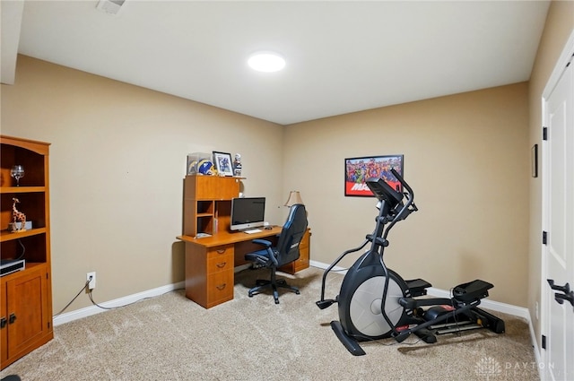 office space featuring baseboards and light carpet