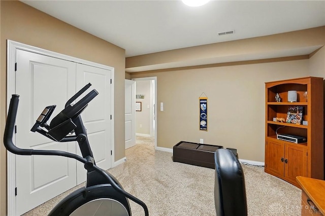 exercise area with baseboards, carpet flooring, and visible vents