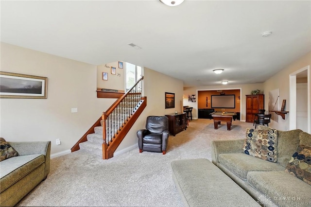 living area featuring stairway, baseboards, light carpet, and visible vents