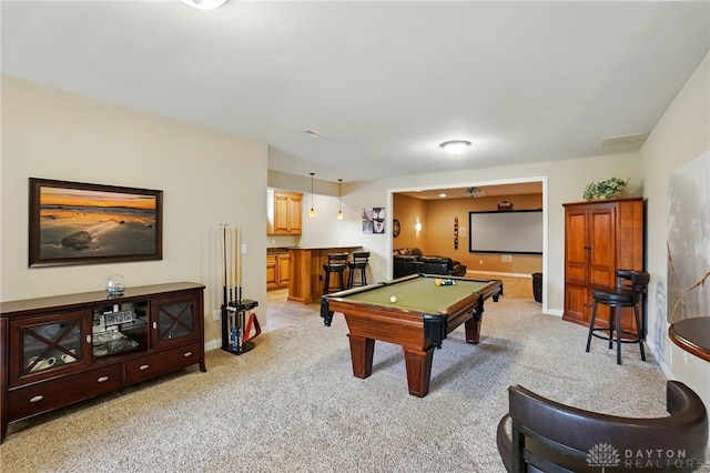 recreation room with billiards, baseboards, and light carpet