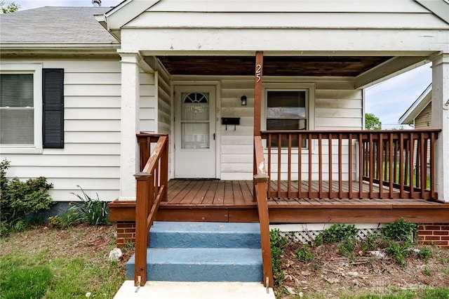entrance to property featuring covered porch