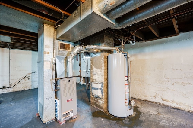 unfinished below grade area featuring visible vents, heating unit, and gas water heater