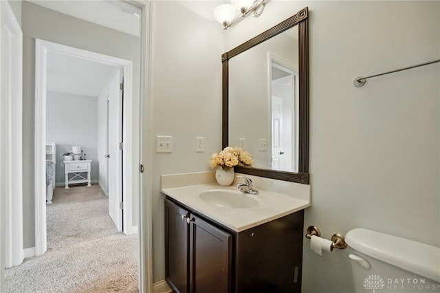 half bath with vanity and toilet