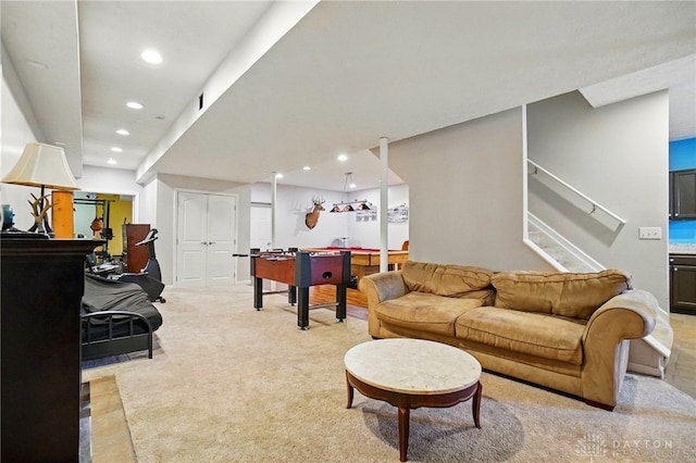 recreation room with recessed lighting and light carpet