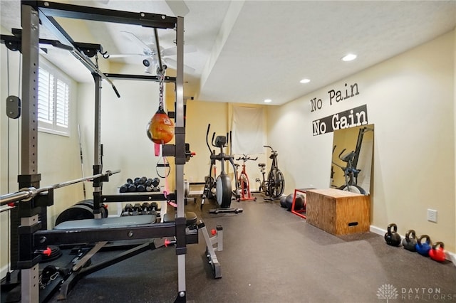 workout area with recessed lighting and baseboards