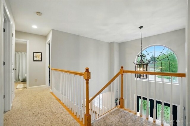 5497 Riverwalk Dr, Kings Mills, OH 45034 - hall with a chandelier, an upstairs landing, and recessed lighting