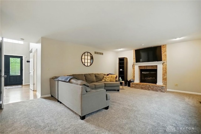 5497 Riverwalk Dr, Kings Mills, OH 45034 - living area with light colored carpet, a fireplace, and baseboards