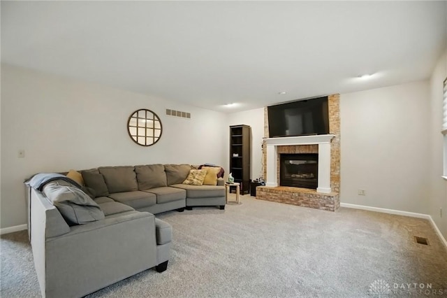 5497 Riverwalk Dr, Kings Mills, OH 45034 - living area featuring carpet floors, a brick fireplace, and baseboards