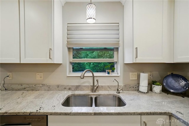 5497 Riverwalk Dr, Kings Mills, OH 45034 - kitchen featuring a sink, white cabinets, and light stone counters