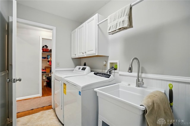 5497 Riverwalk Dr, Kings Mills, OH 45034 - laundry area with independent washer and dryer, cabinet space, and light wood-style flooring