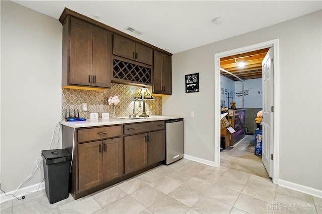 5497 Riverwalk Dr, Kings Mills, OH 45034 - indoor wet bar with stainless steel dishwasher, backsplash, and baseboards
