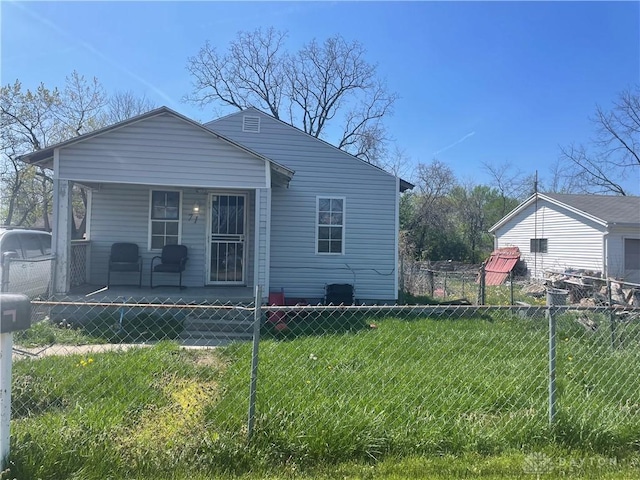 view of property exterior featuring a porch, a yard, and fence private yard