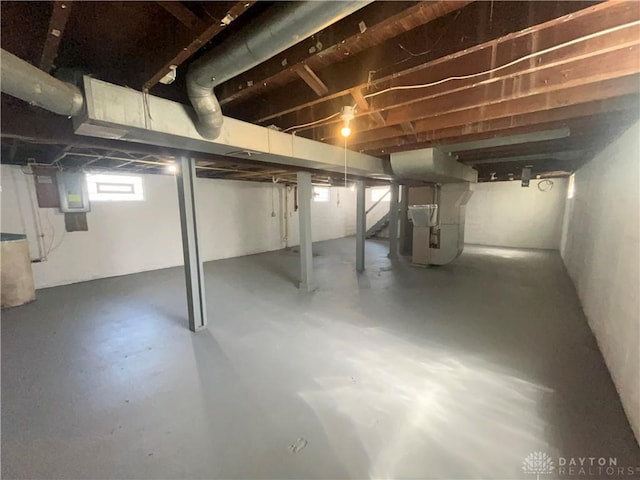 2828 Wilbraham Rd, Middletown, OH 45042 - basement featuring heating unit, electric panel, and stairway