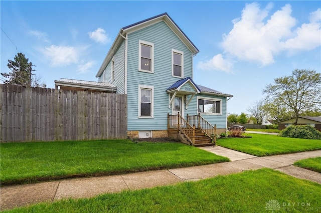 view of front of property featuring fence and a front yard