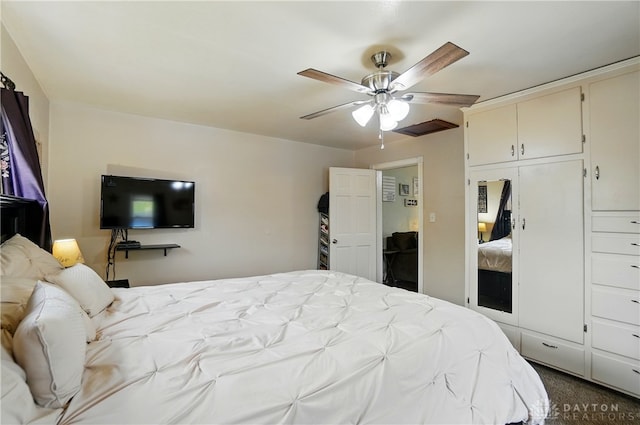 bedroom with ceiling fan and a closet