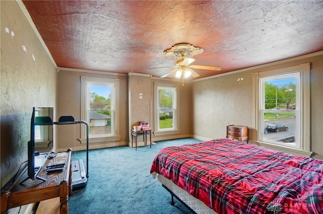 carpeted bedroom with baseboards, a textured wall, multiple windows, and ornamental molding