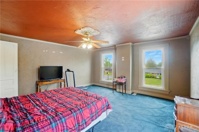 bedroom featuring carpet floors, a ceiling fan, baseboards, and ornamental molding