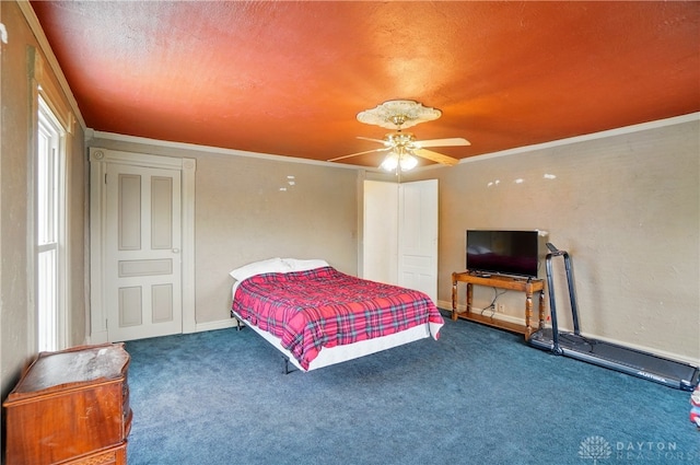 carpeted bedroom with crown molding and ceiling fan