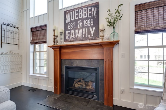 interior details featuring a tiled fireplace and visible vents