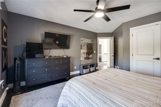 bedroom with baseboards and ceiling fan
