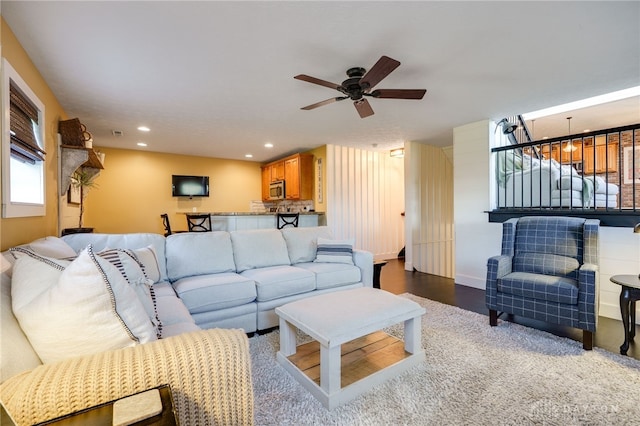 living room with recessed lighting, ceiling fan, and wood finished floors