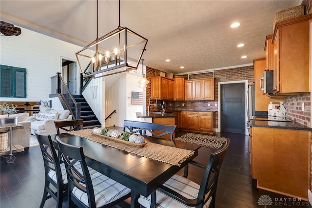 dining area with recessed lighting, brick wall, and dark wood-style floors