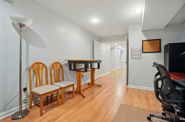 home office featuring recessed lighting, baseboards, and light wood-style floors