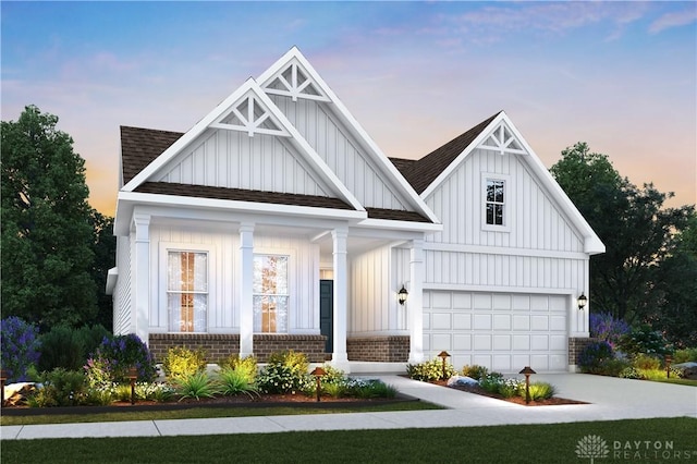 modern farmhouse style home with a garage, a shingled roof, board and batten siding, concrete driveway, and a porch