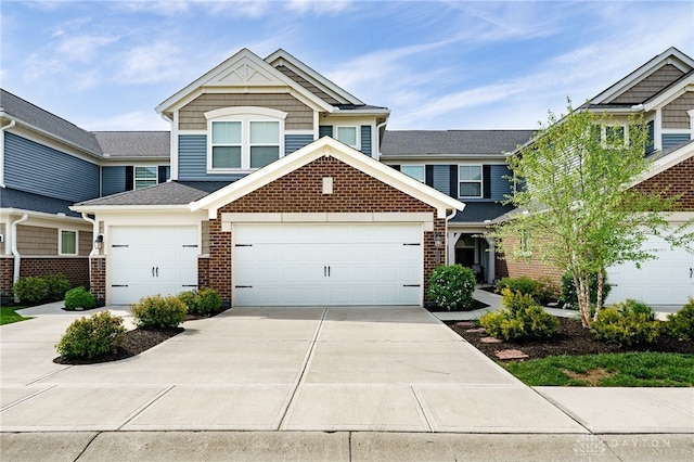 view of front of house featuring brick siding and driveway