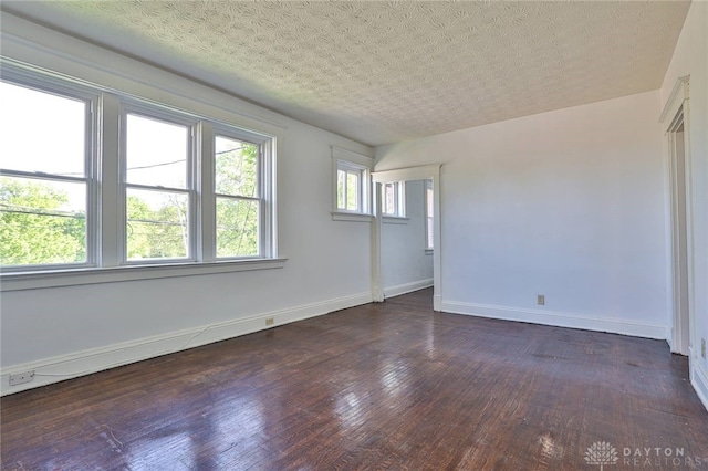 3733-3735 Reading Rd, Cincinnati, OH 45229 - spare room with baseboards and dark wood-style flooring