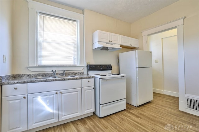 3733-3735 Reading Rd, Cincinnati, OH 45229 - kitchen with white cabinets, a sink, white appliances, light wood-type flooring, and under cabinet range hood