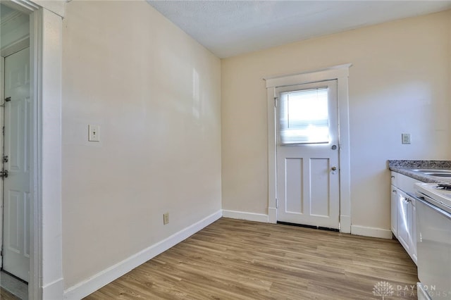 3733-3735 Reading Rd, Cincinnati, OH 45229 - doorway to outside with baseboards and light wood-style flooring