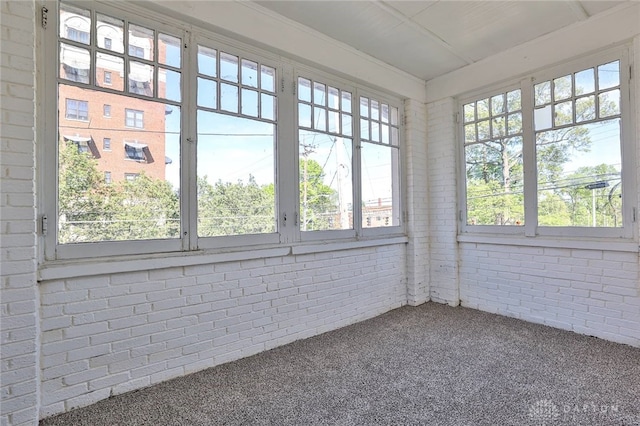 3733-3735 Reading Rd, Cincinnati, OH 45229 - unfurnished sunroom featuring carpet floors and brick wall