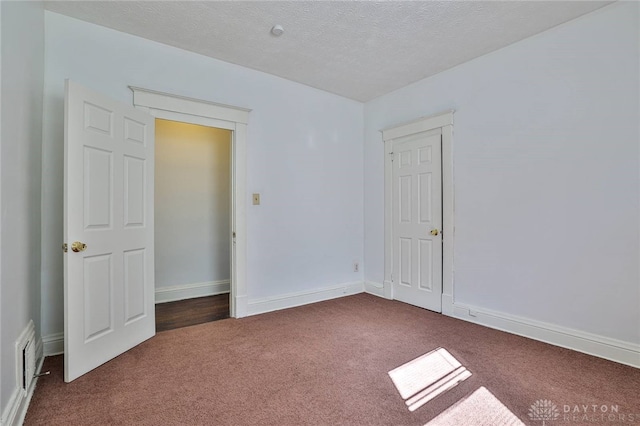 3733-3735 Reading Rd, Cincinnati, OH 45229 - carpeted empty room featuring a textured ceiling and baseboards