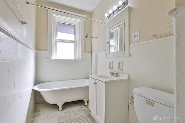 3733-3735 Reading Rd, Cincinnati, OH 45229 - bathroom with toilet, a soaking tub, and vanity