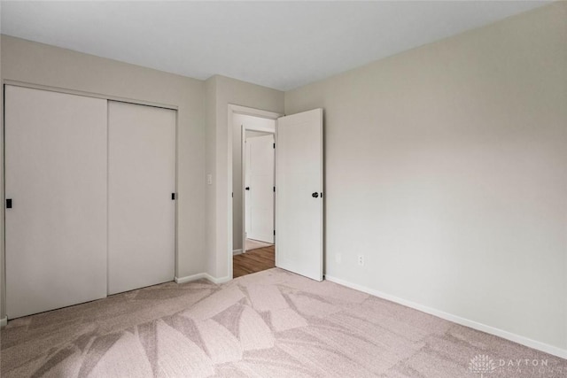 1330 E Centerville Station Rd, Dayton, OH 45459 - unfurnished bedroom featuring carpet floors, baseboards, and a closet