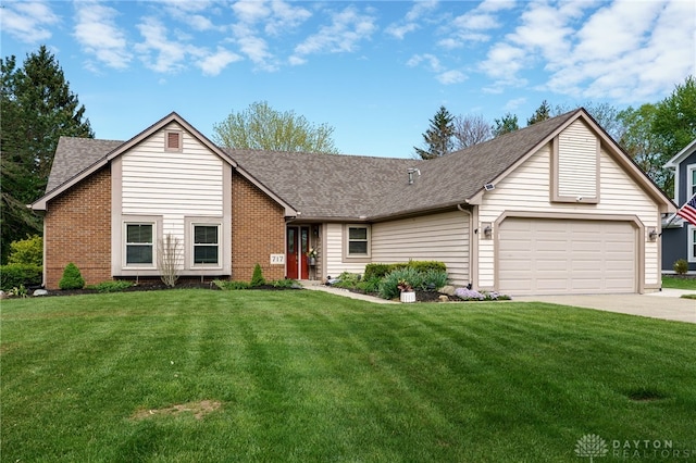 717 Walden Way, Dayton, OH 45440 - ranch-style home with roof with shingles, concrete driveway, an attached garage, and a front yard