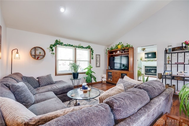 717 Walden Way, Dayton, OH 45440 - living area with lofted ceiling, baseboards, a glass covered fireplace, ceiling fan, and wood finished floors