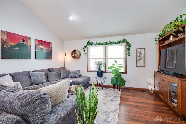 717 Walden Way, Dayton, OH 45440 - living room with vaulted ceiling, dark wood-type flooring, and baseboards