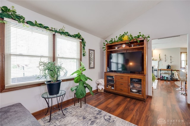717 Walden Way, Dayton, OH 45440 - living area featuring vaulted ceiling, baseboards, and wood finished floors