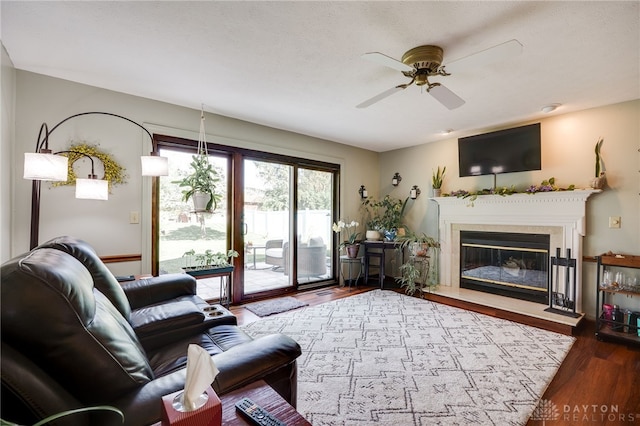 717 Walden Way, Dayton, OH 45440 - living room featuring a ceiling fan, a glass covered fireplace, and wood finished floors