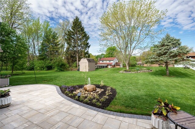 717 Walden Way, Dayton, OH 45440 - view of yard with a patio, an outbuilding, and a storage unit