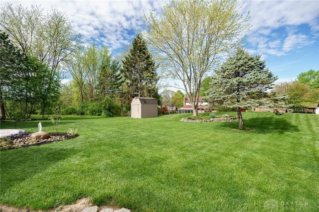 717 Walden Way, Dayton, OH 45440 - view of yard featuring a storage unit and an outbuilding