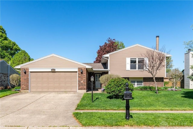 tri-level home featuring concrete driveway, brick siding, an attached garage, and a front yard